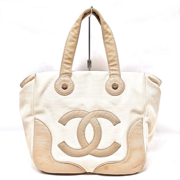 CHANEL Handbags - 100% Authentic Chanel Beige Canvas Hand Bag